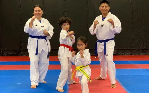 a group of people in karate uniforms