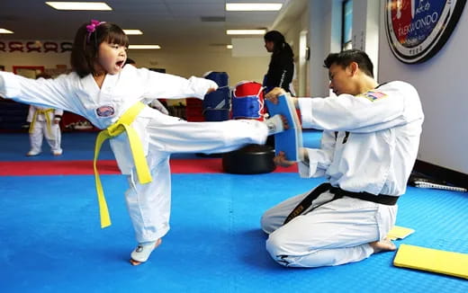 a man and a woman in karate uniforms