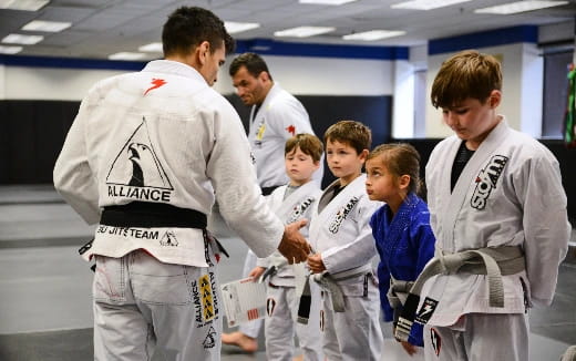 a group of people in karate uniforms