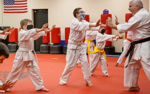 a group of people in karate uniforms