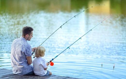 a man and a child fishing