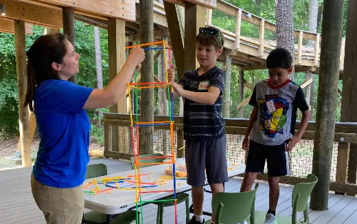 a group of kids playing with a toy