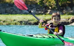 a boy in a kayak