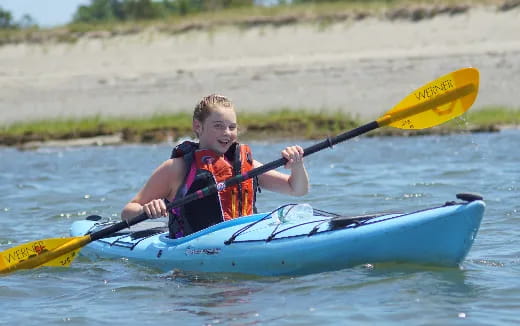 a boy in a kayak