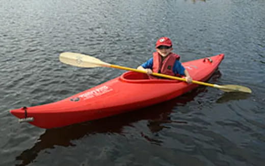 a man in a red kayak