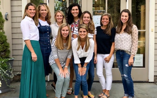 a group of women posing for a photo