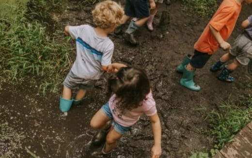children playing in mud