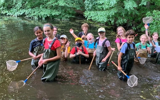 a group of people in a river