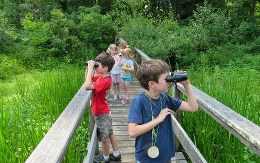 a group of kids taking pictures