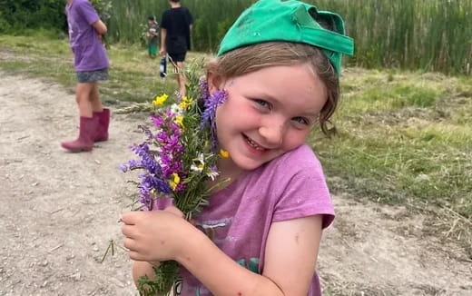 a girl holding flowers