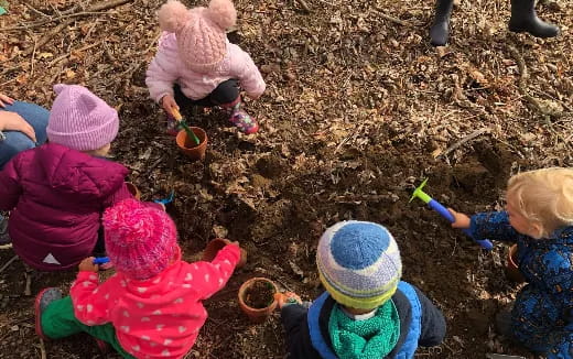 a group of children playing with a toy