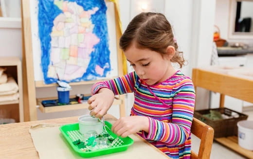 a young girl painting