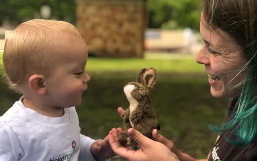 a woman holding a baby