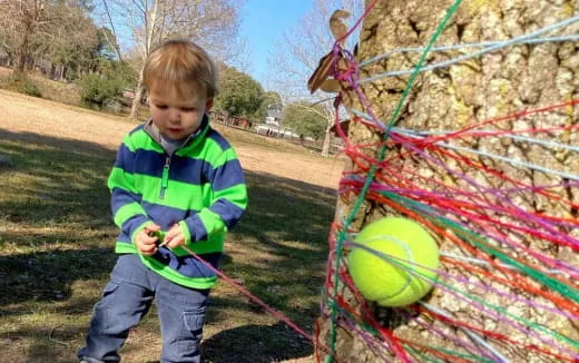 a boy holding a ball