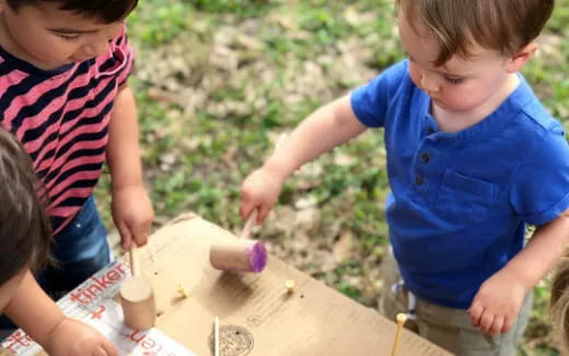 a group of kids playing with sand