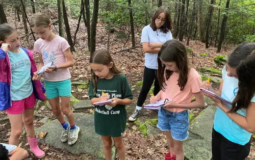 a group of girls in a forest