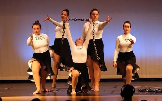 a group of women dancing on a stage