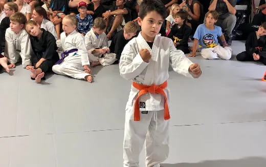 a boy in karate uniform