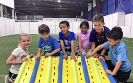 a group of children playing on a playground