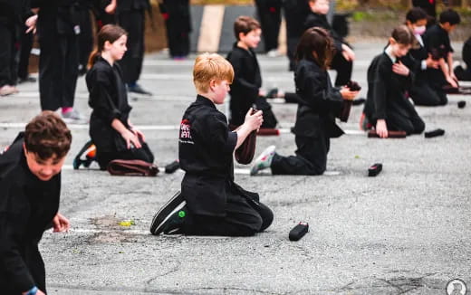 a group of people kneeling on the ground