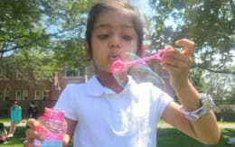 a young girl brushing her teeth