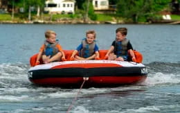 a group of boys in a boat