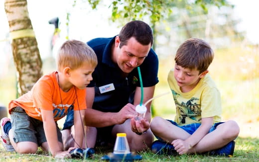 a person and two boys