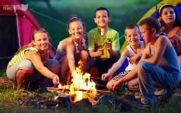 a group of people around a fire