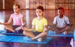 a group of people sitting on a mat