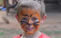 a boy with a face paint