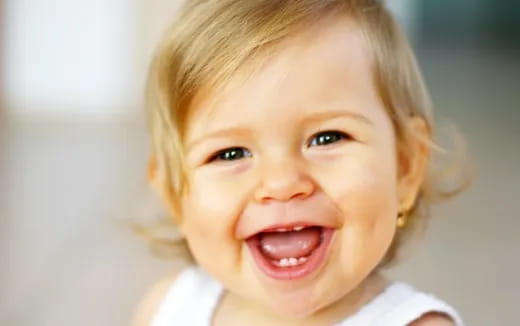 a close-up of a child smiling
