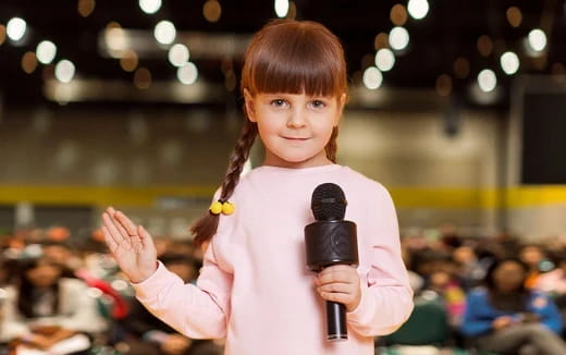 a girl holding a microphone