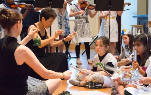 a group of people sitting on the floor