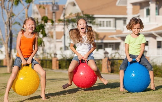 a group of girls playing with balls