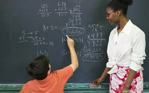 a teacher teaching a student