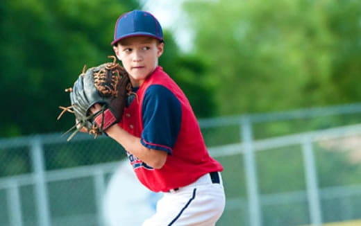 a baseball player in a red shirt