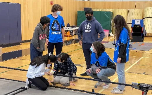 a group of people kneeling on the floor