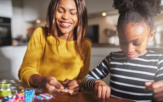 a person and a boy playing with toys