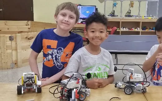 a group of boys with toy cars