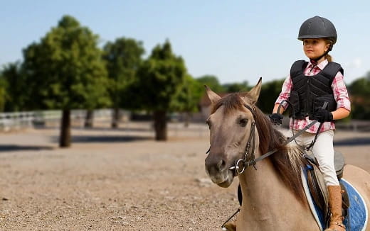 a girl riding a horse