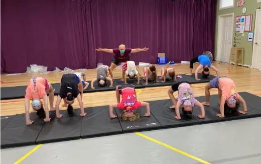 a group of people doing yoga