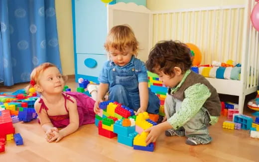 a group of children playing with toys