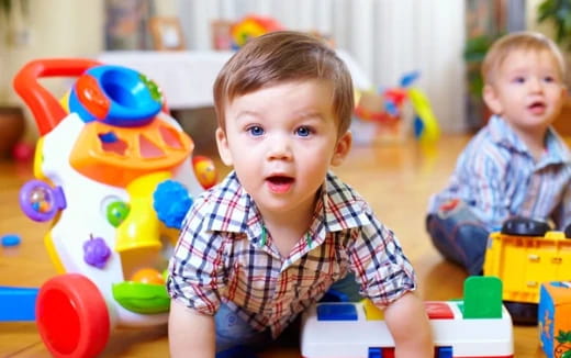 a couple of kids playing with toys