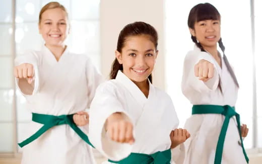 a group of women in white lab coats