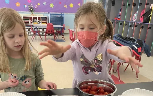 a couple of girls eating