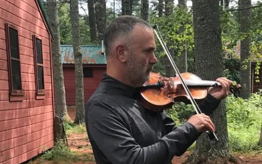 a man playing a violin