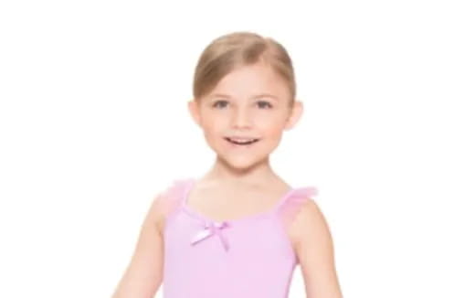 a child wearing a pink dress