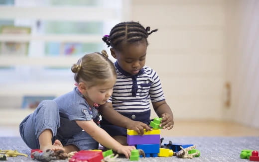 a couple of children playing with toys