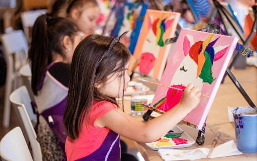 a group of children painting