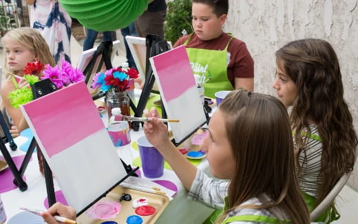 a group of children painting